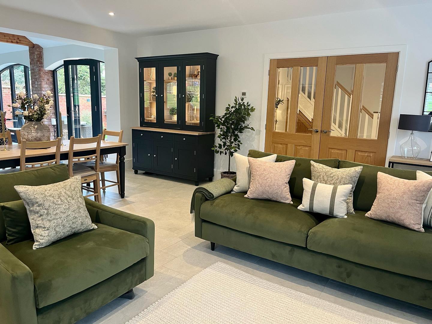 7. Soften Matching Green Seats With Blush Cushions