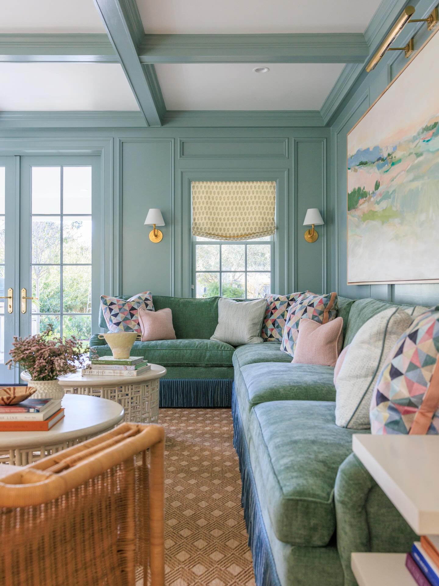 11. Carry Soft Green Into a Paneled Family Room