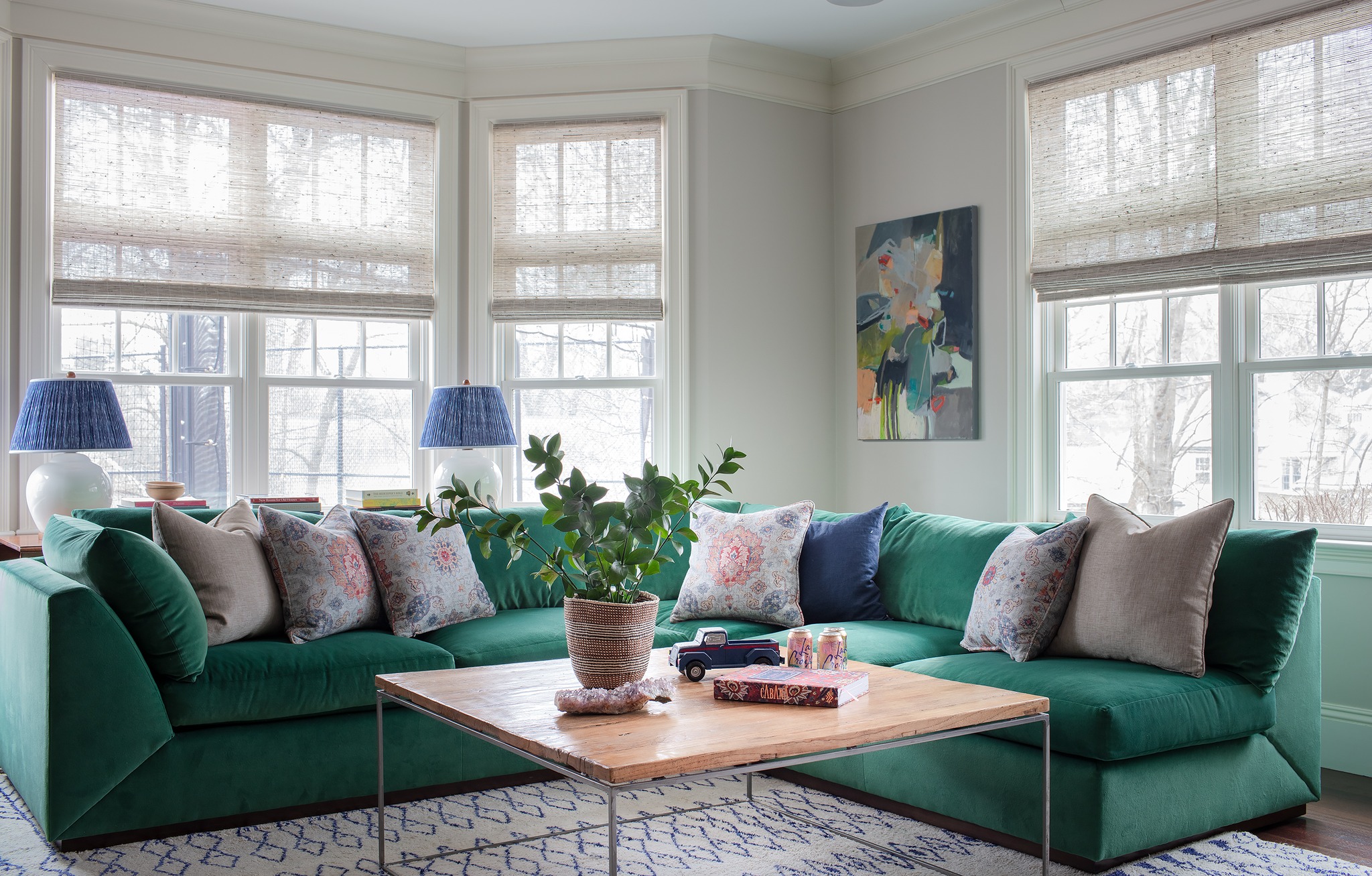 16. Lift an Emerald Sectional With Blue Accents