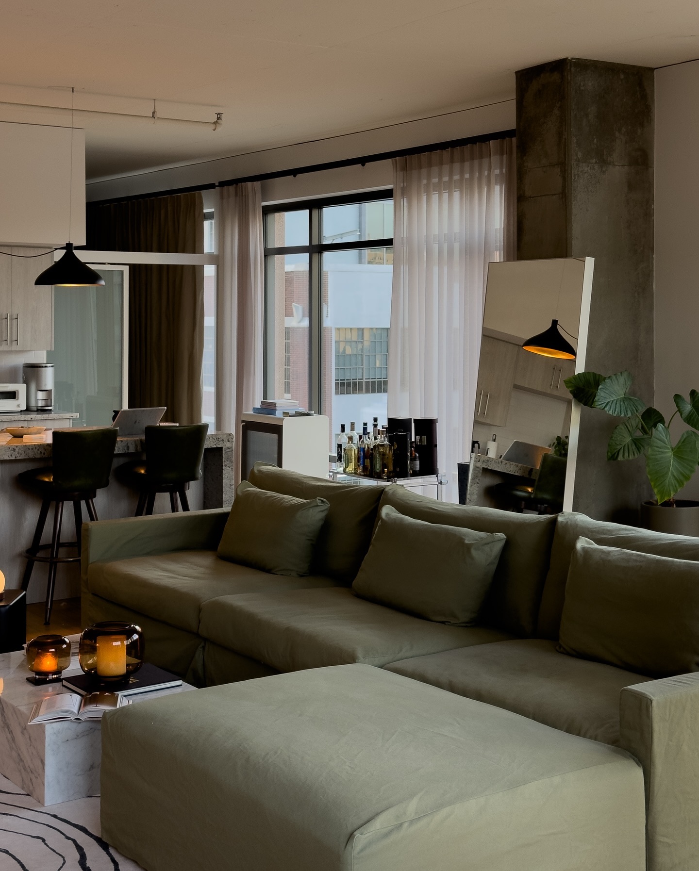 19. Float a Sage Sectional Beside an Open Kitchen