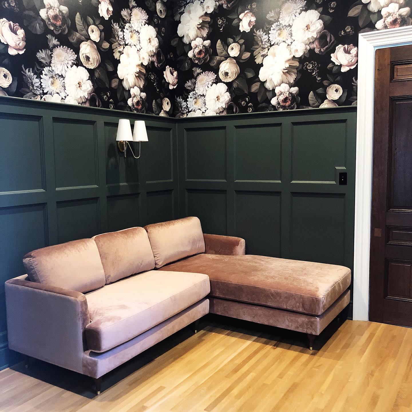 15. Set Pink Seating Against Deep Green Paneling