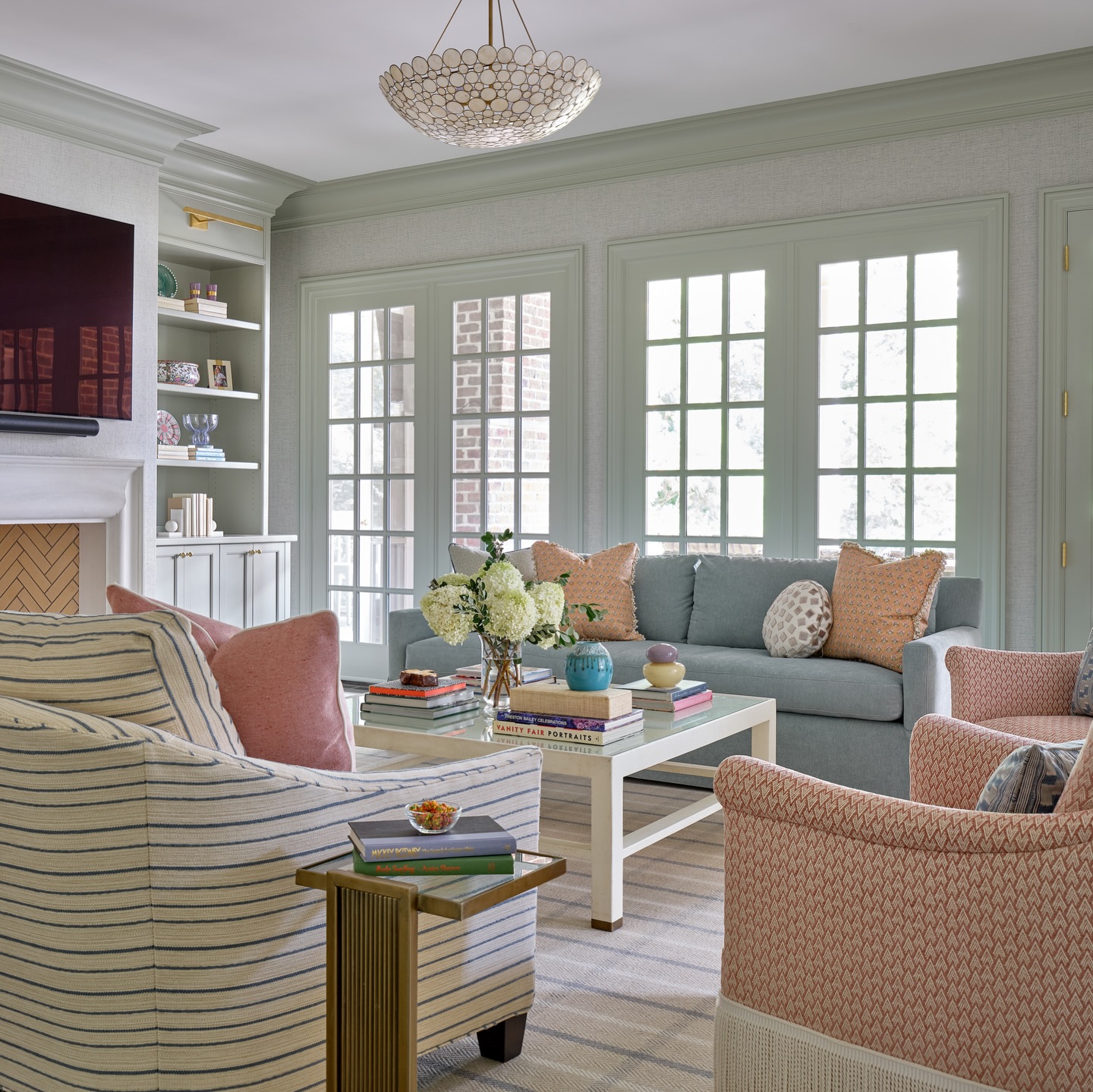 7. Mix Pink Patterned Chairs With a Blue Gray Sofa