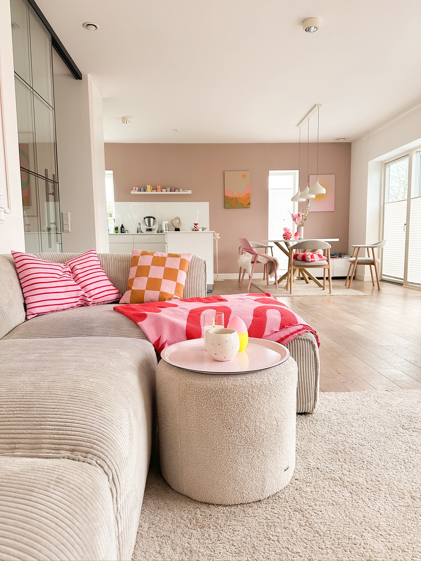 8. Refresh a Warm Gray Sectional With Pink Patterns