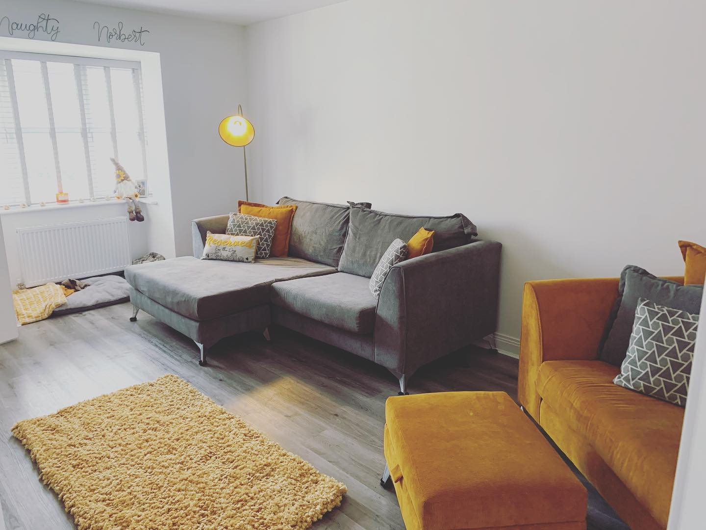 14. Warm Up a Gray Floor With Mustard Seating