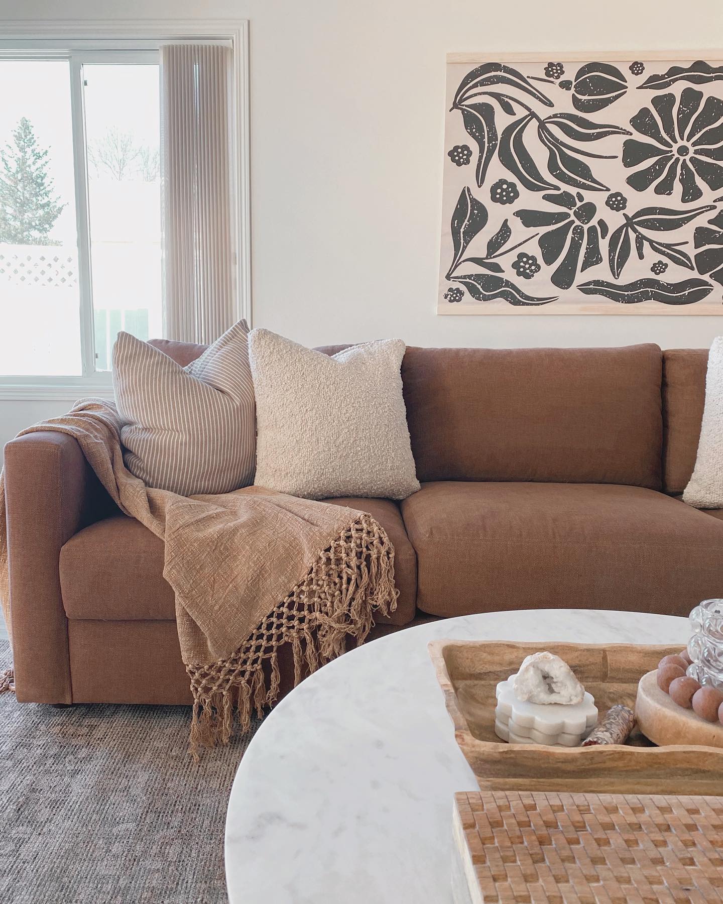 19. Soften a Brown Sofa With a Gray Patterned Rug