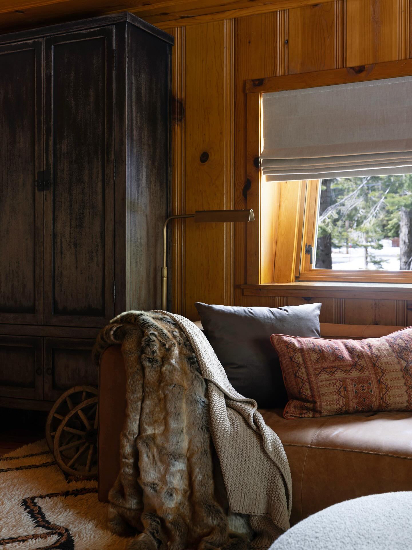 20. Cool a Wood-Paneled Room With Gray Textiles