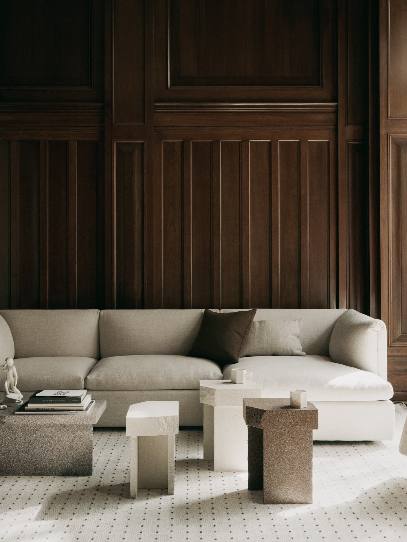 5. Pair Rich Wood Walls With a Pale Sofa