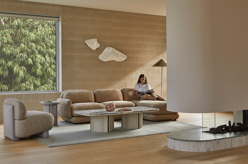 19. Mix Rounded Upholstery With Stone Surfaces