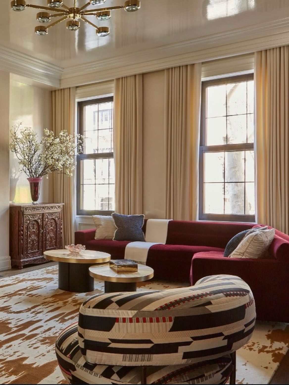 19. Warm a Ruby Sofa with Cream Surroundings
