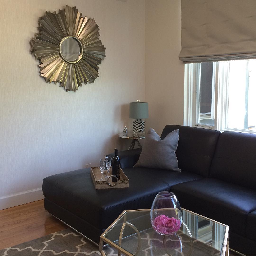 7. Lighten a Black Sectional With Reflective Accents
