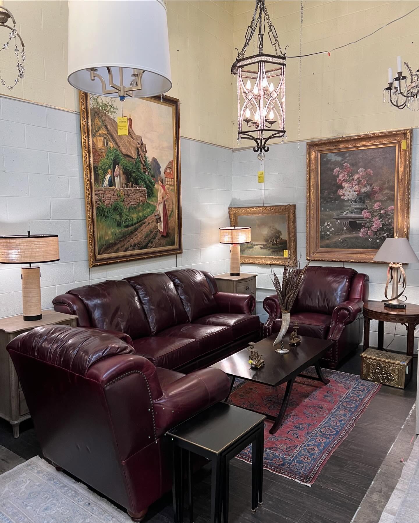 9. Pair Burgundy Leather With Ornate Framed Art