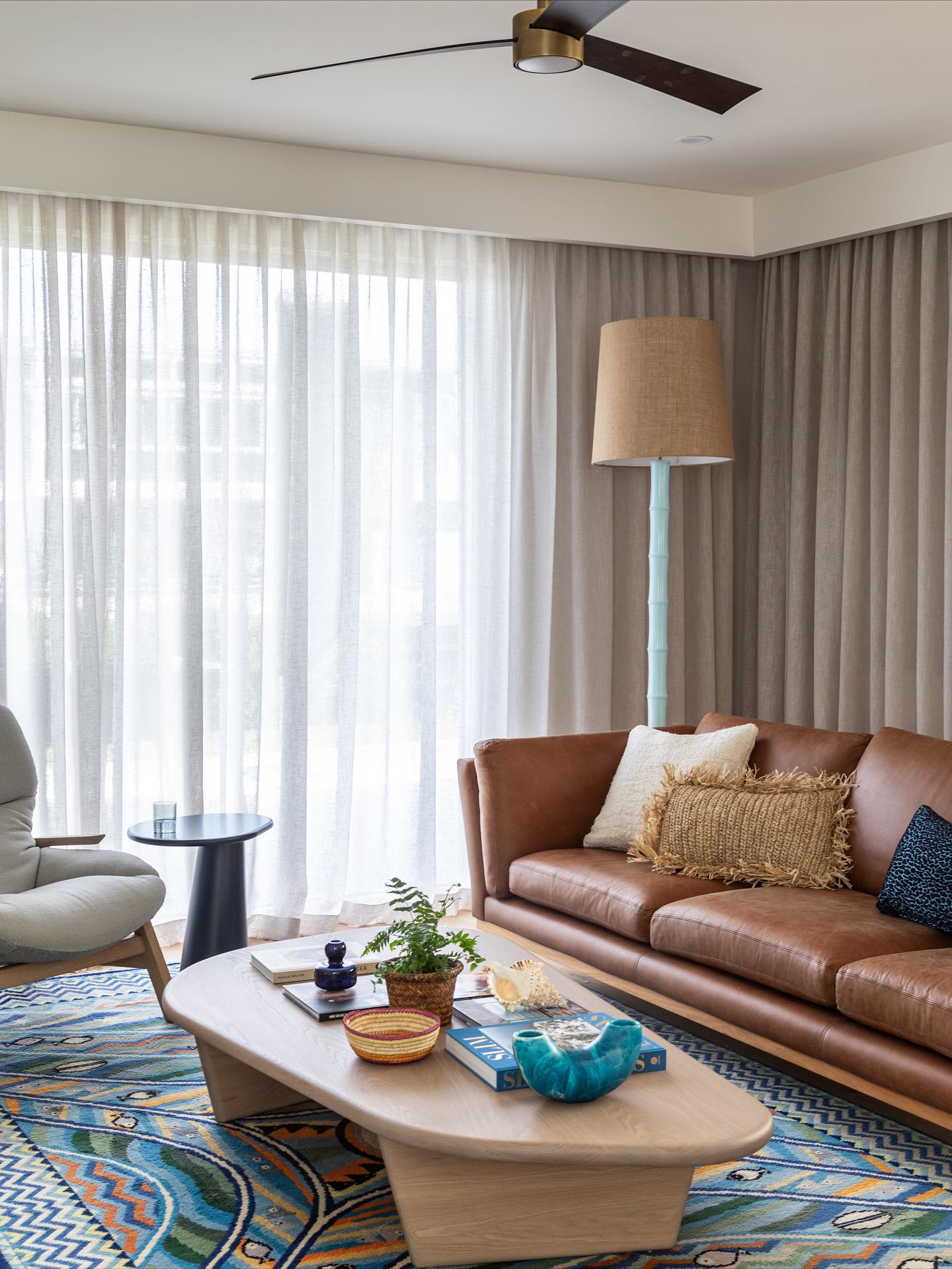 11. Refresh an Existing Leather Sofa With a Colorful Rug
