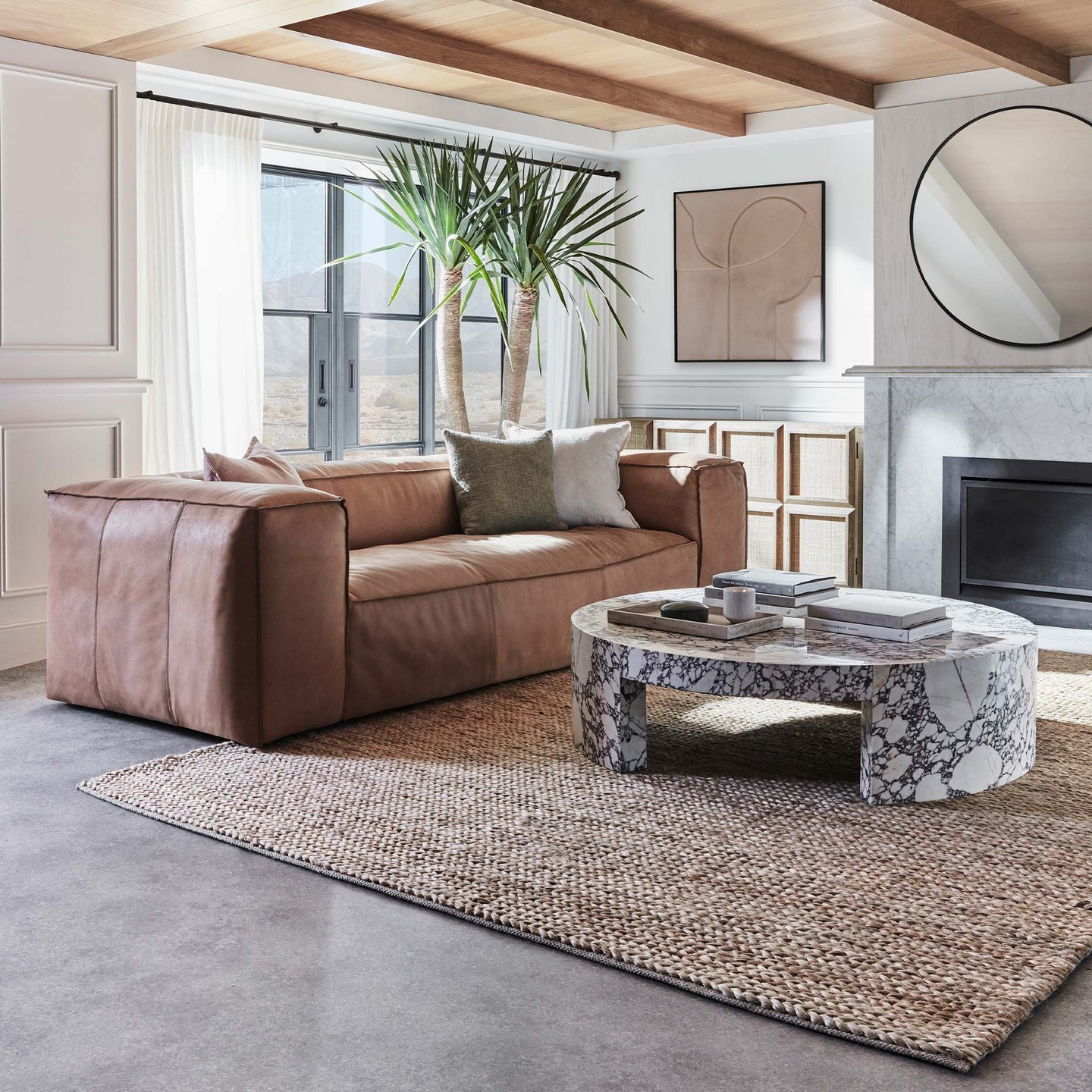 14. Balance Broad Sofa Arms With a Substantial Round Table