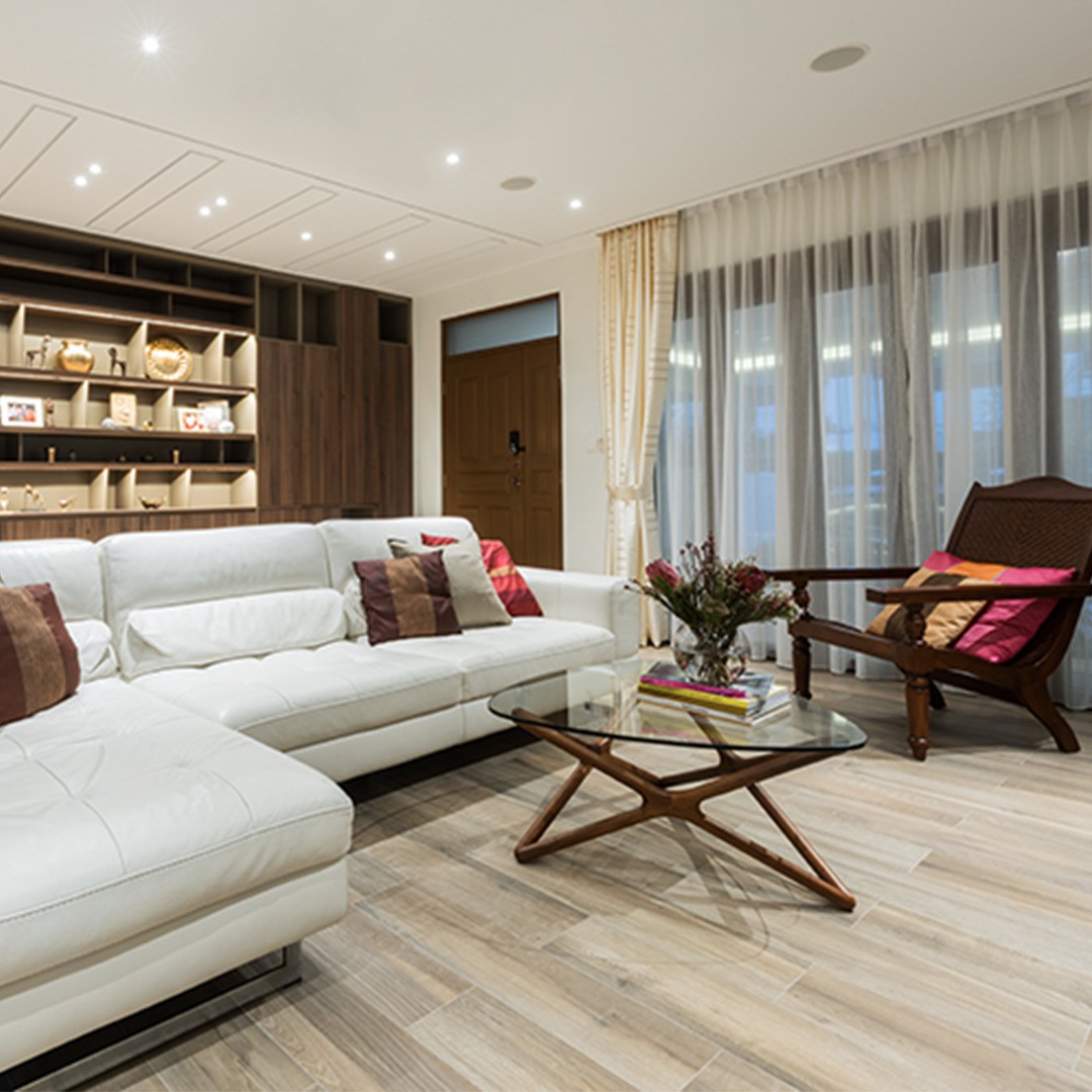 16. Repeat Warm Wood Around a White Leather Sectional