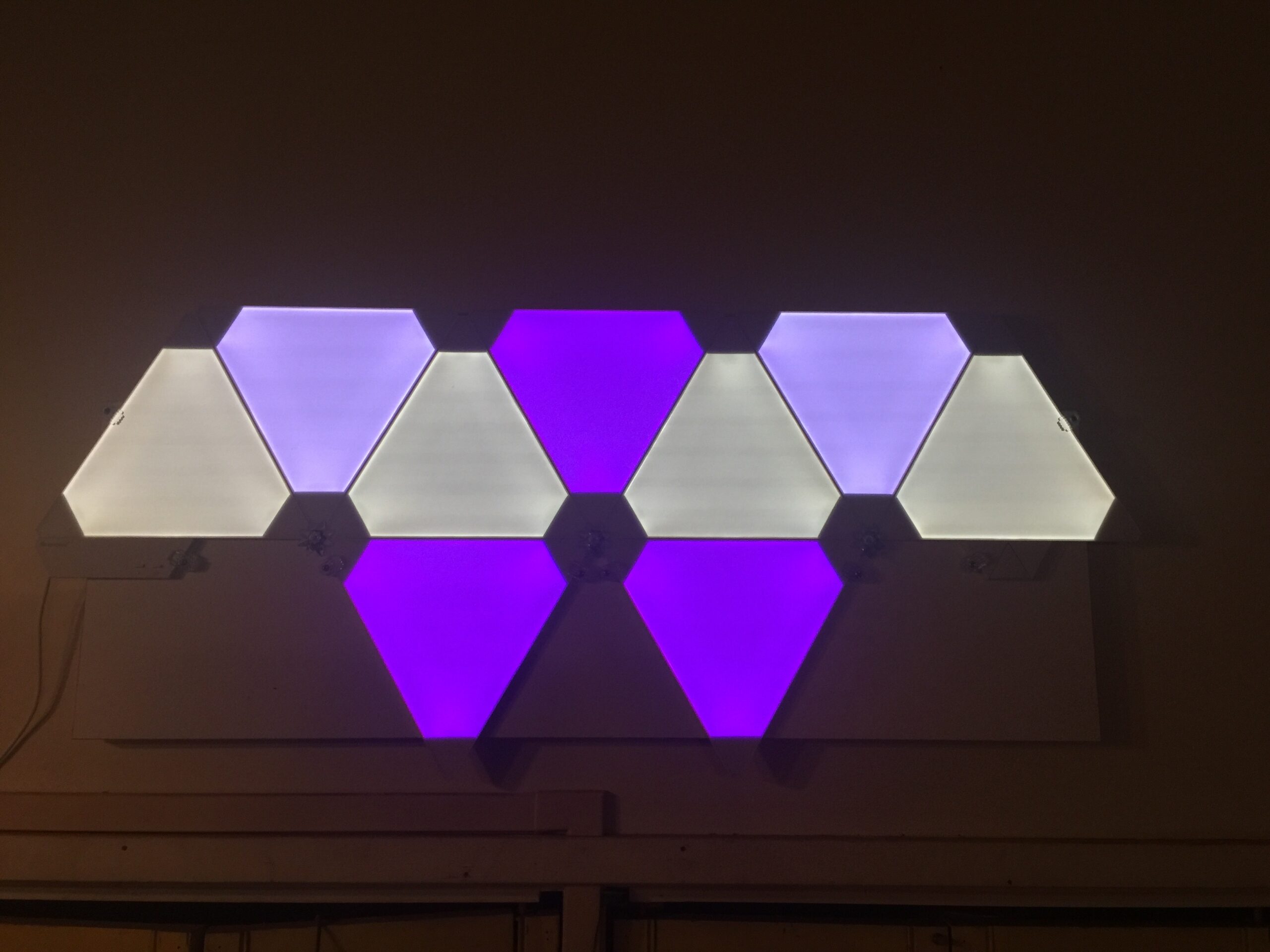 7. Arrange Light Panels as Geometric Wall Art