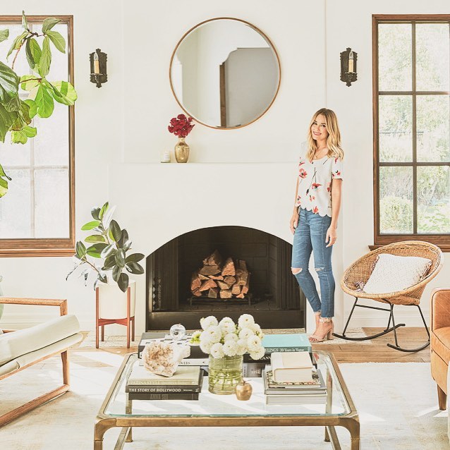 2. Soften a Fireplace Wall With a Round Mirror