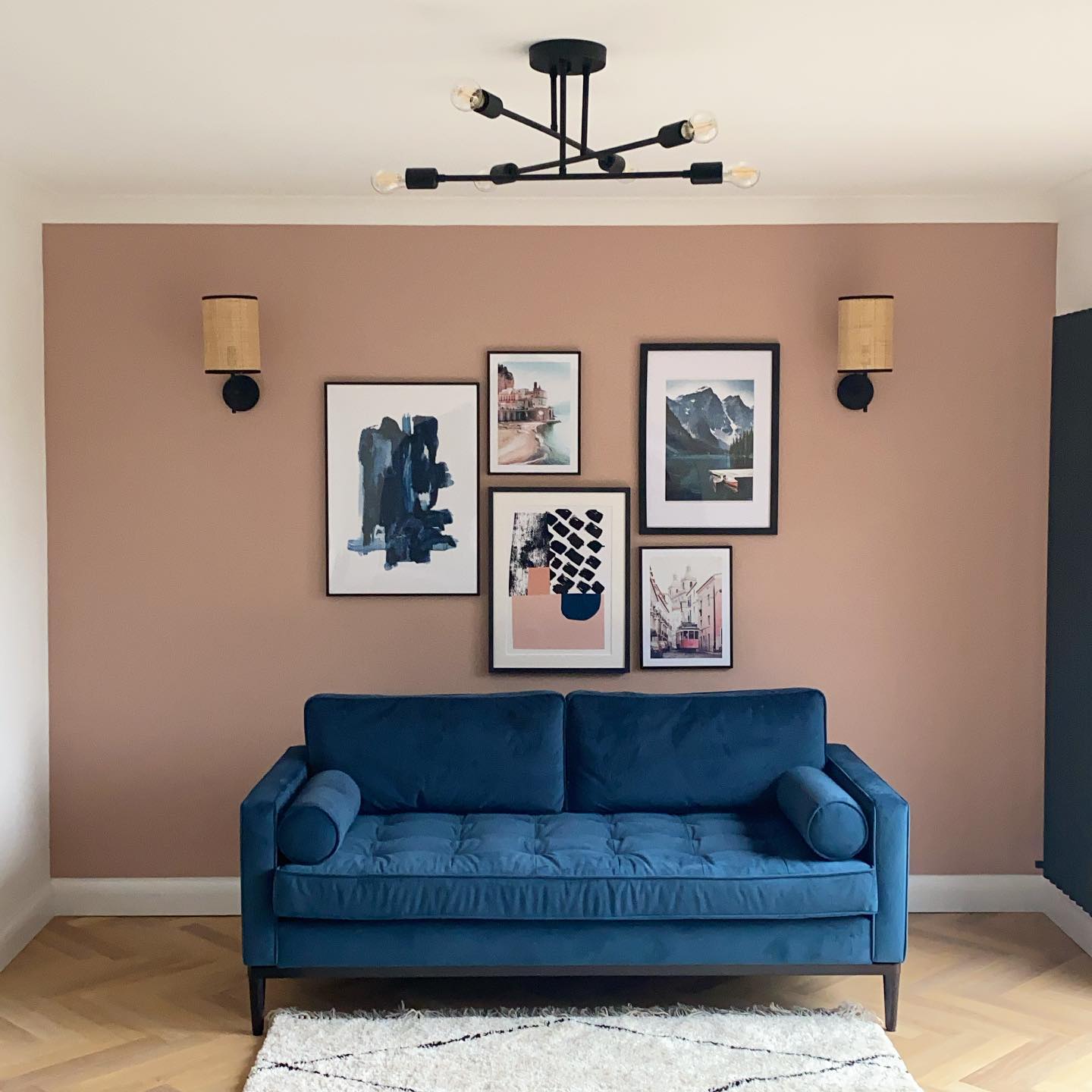 4. Frame a Gallery Wall With Matching Sconces