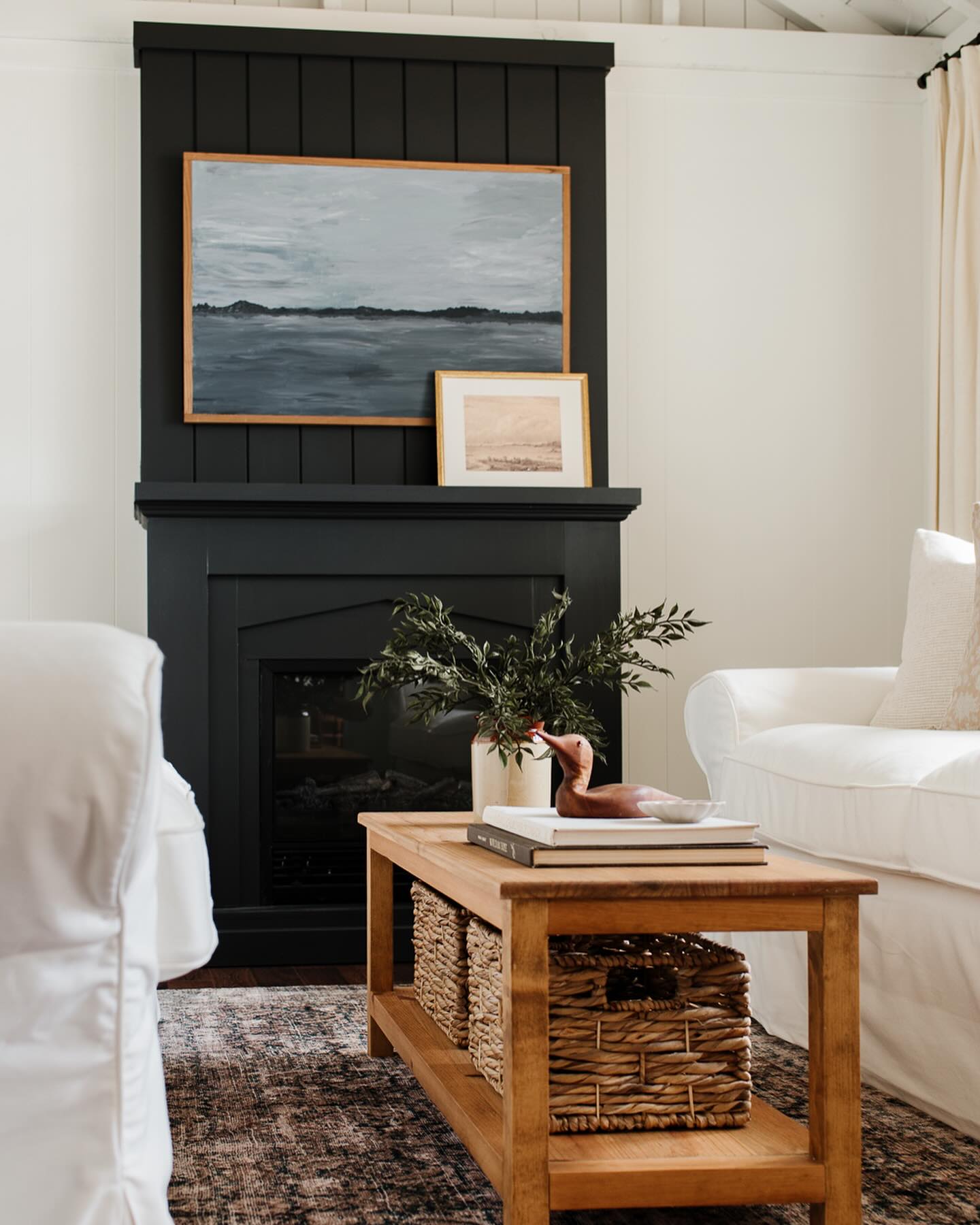 5. Layer Two Coastal Prints Above the Fireplace