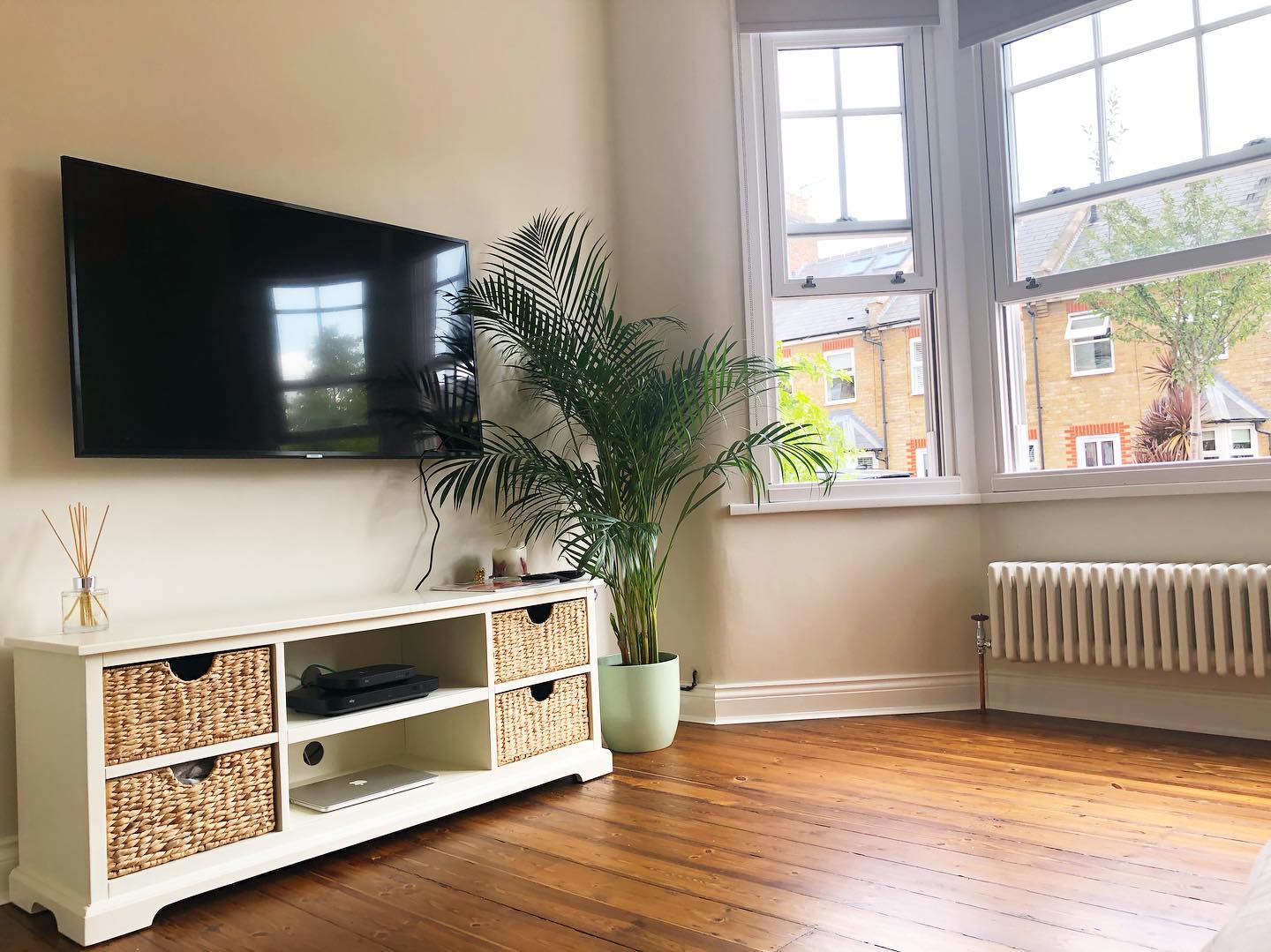 9. Use Matching Baskets to Organize the TV Console