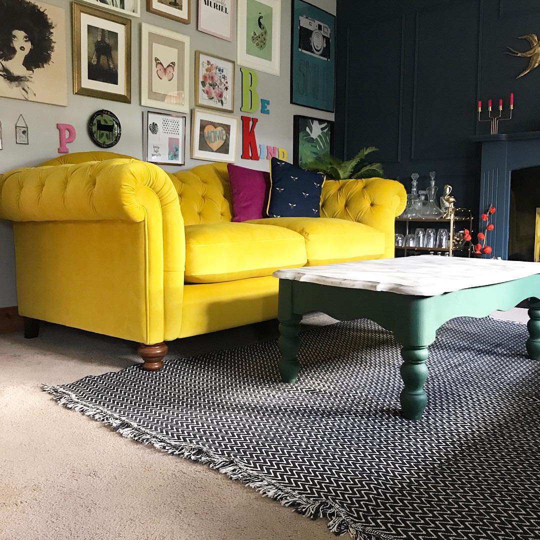 3. Balance a Yellow Sofa With a Deep Blue Wall