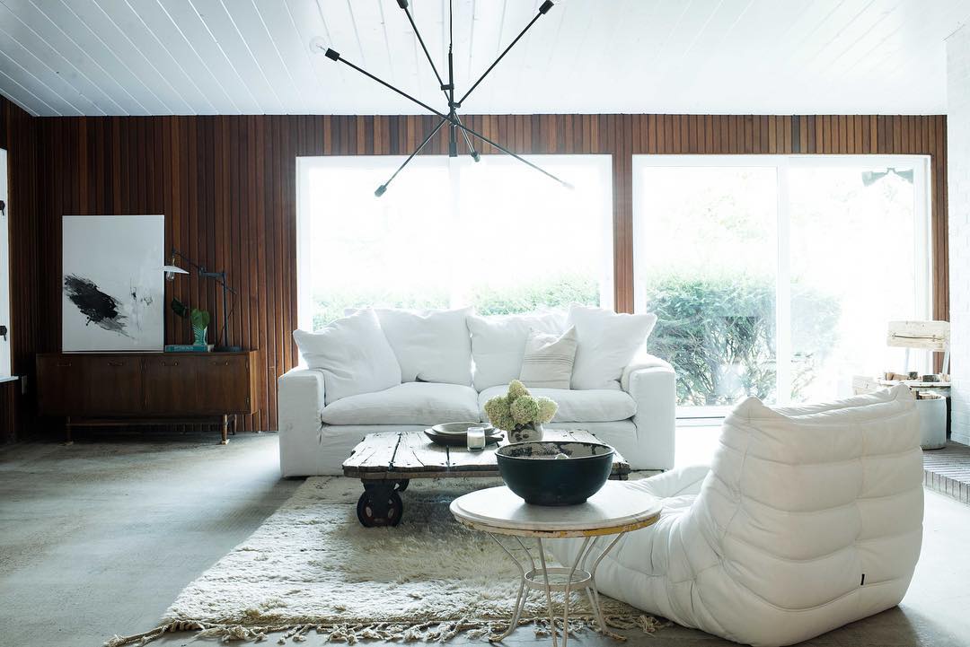 9. Balance Warm Wood Paneling With White Seating