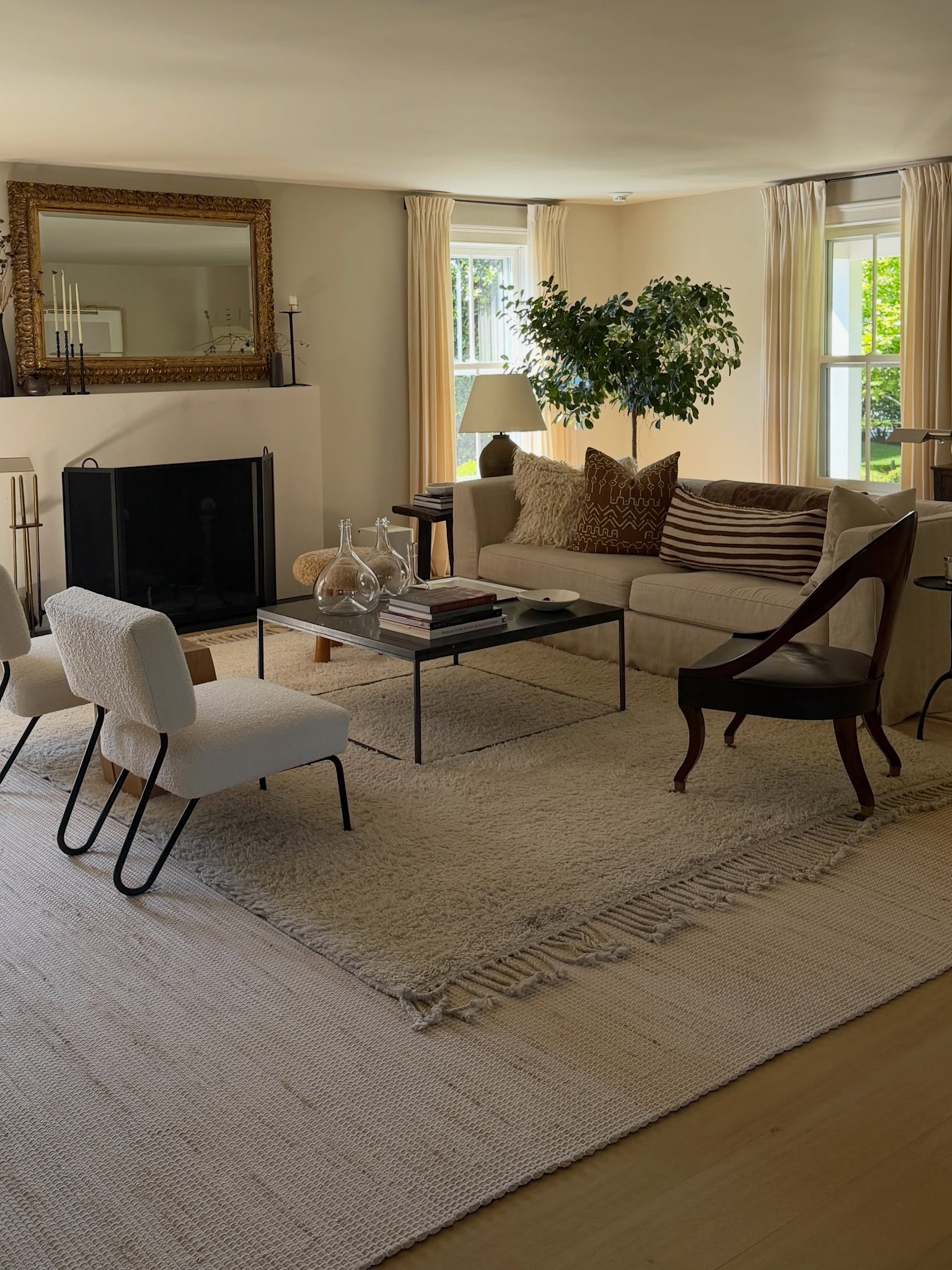 10. Layer Neutral Rugs Around a Conversation Group