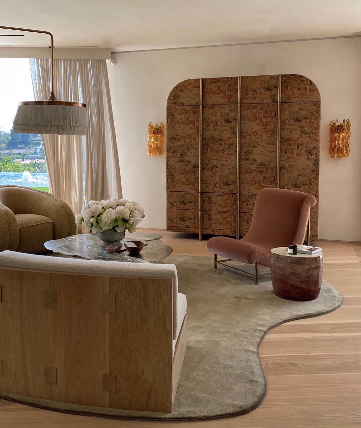 19. Define a Seating Group With a Curved Rug