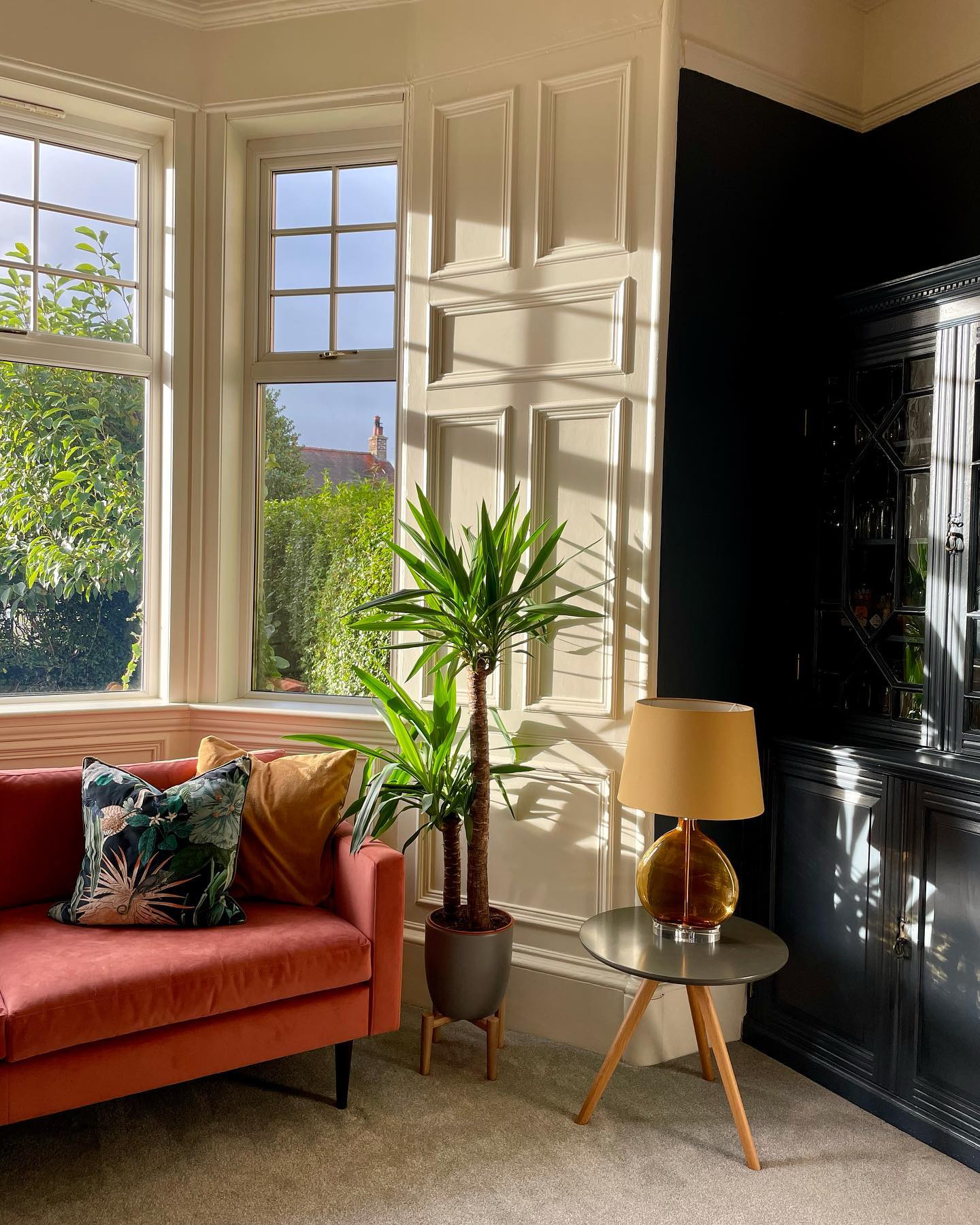 20. Refresh a Neutral Bay With a Warm Sofa