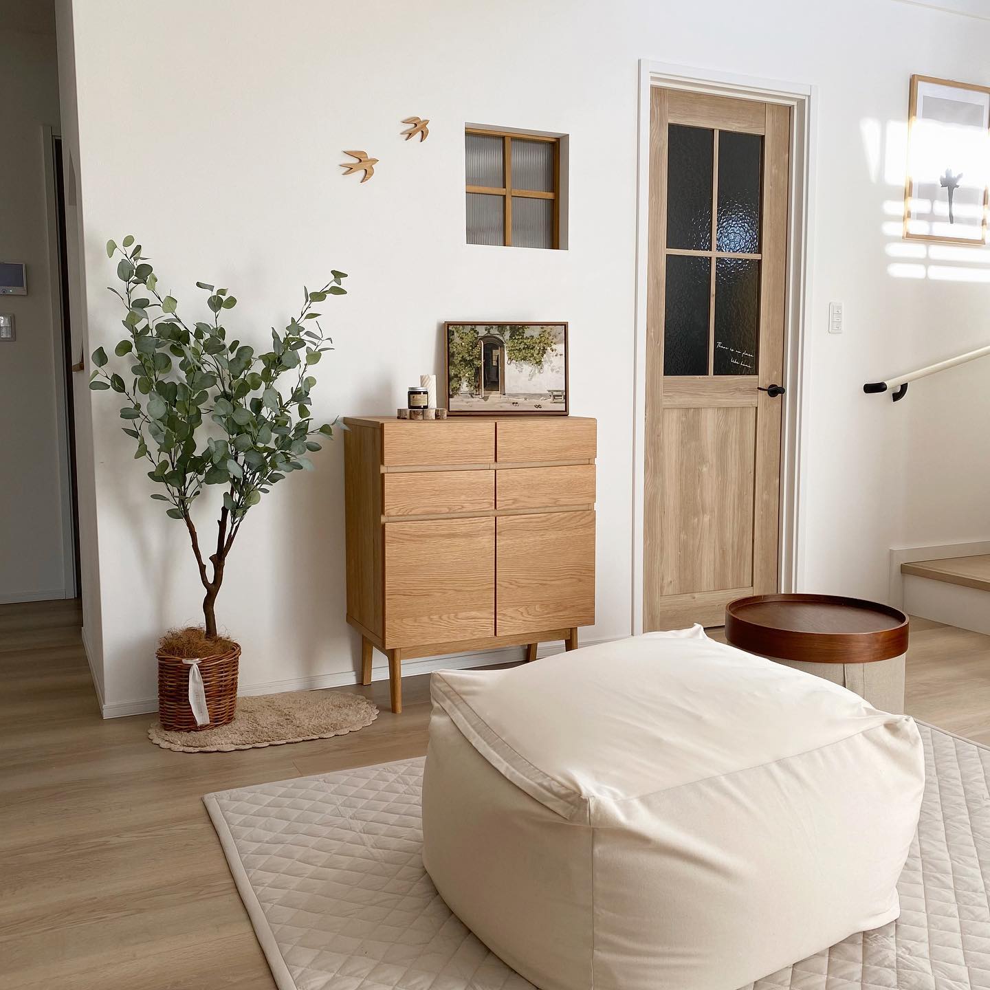 17. Balance a Soft Floor Seat With Practical Wall Storage