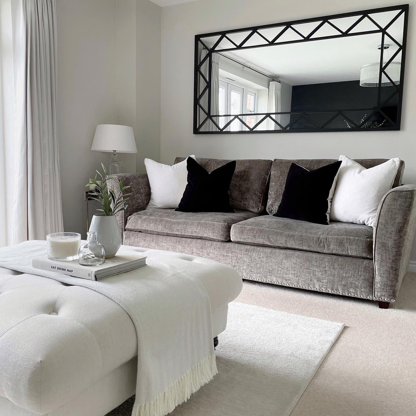 15. Bring Graphic Contrast Above a Neutral Sofa