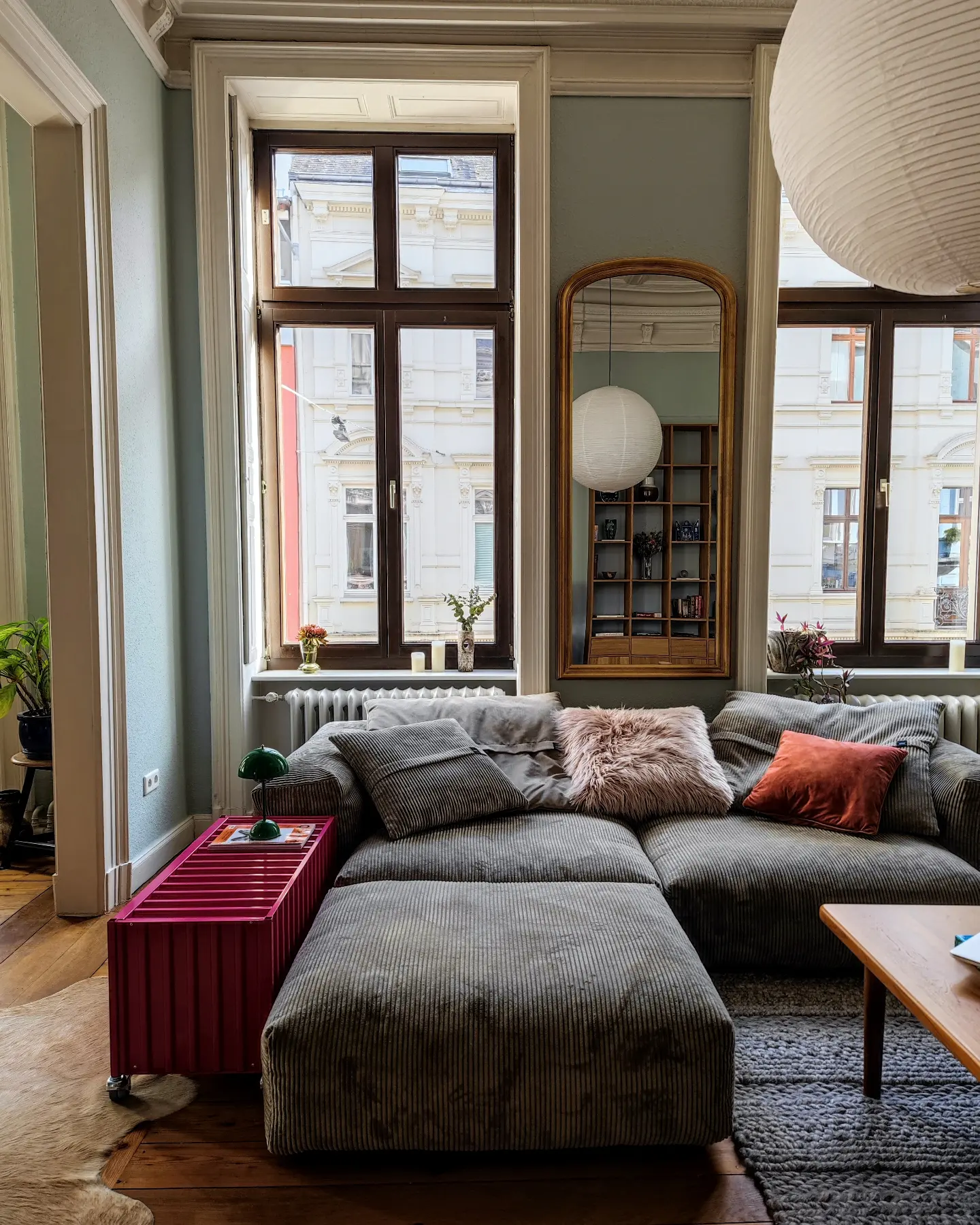 4. Fit a Tall Mirror Between Living Room Windows