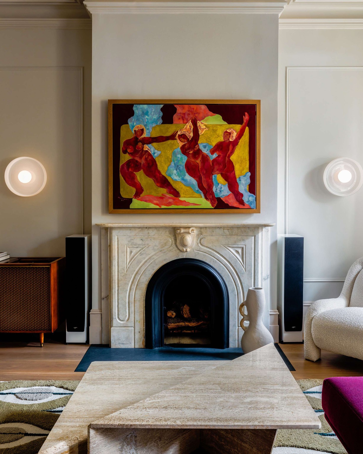 8. Flank a Colorful Mantel Painting with Simple Sconces