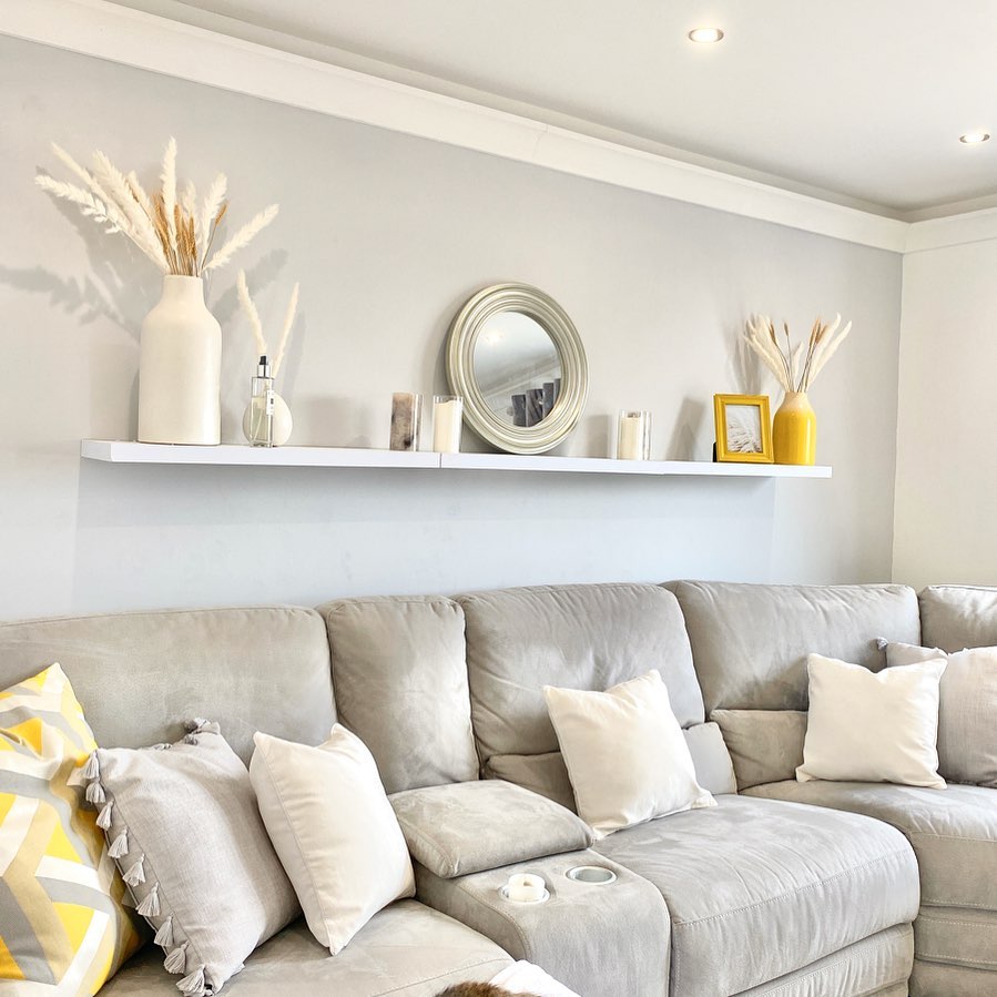 12. Run One Long Display Shelf Above the Sofa