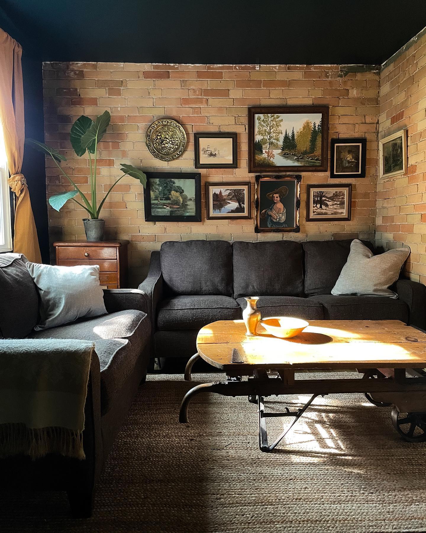 13. Hang Family Artwork Against Exposed Brick