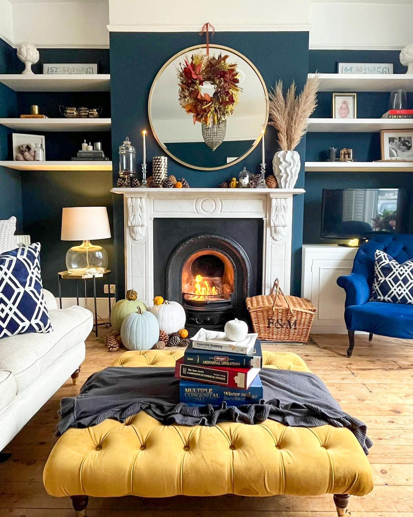 16. Layer a Seasonal Wreath Over a Mantel Mirror