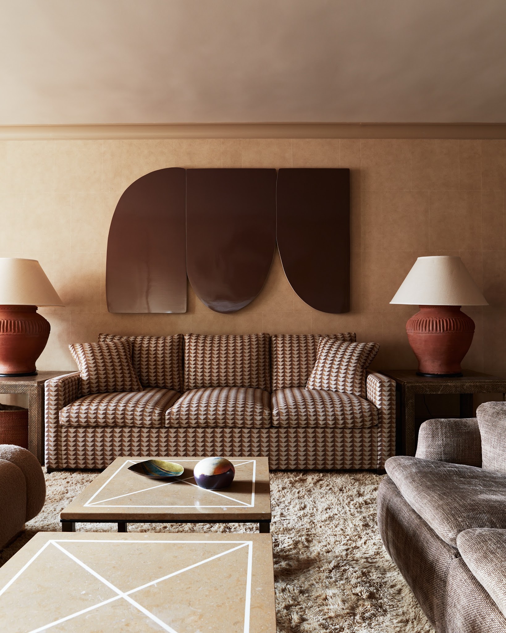19. Use Sculptural Wall Panels Above Patterned Seating