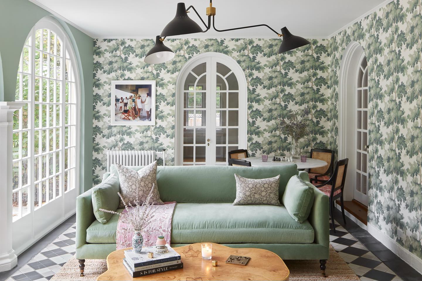 16. Echo Leafy Wallpaper With a Soft Green Sofa