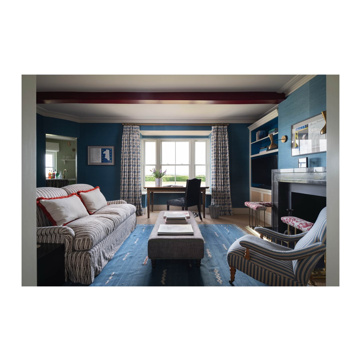 8. Place a Small Desk at the Window End