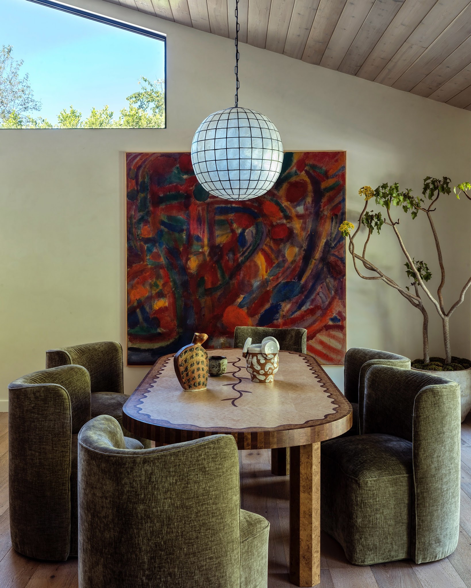 6. Soften a Wood Dining Table with Olive Upholstery