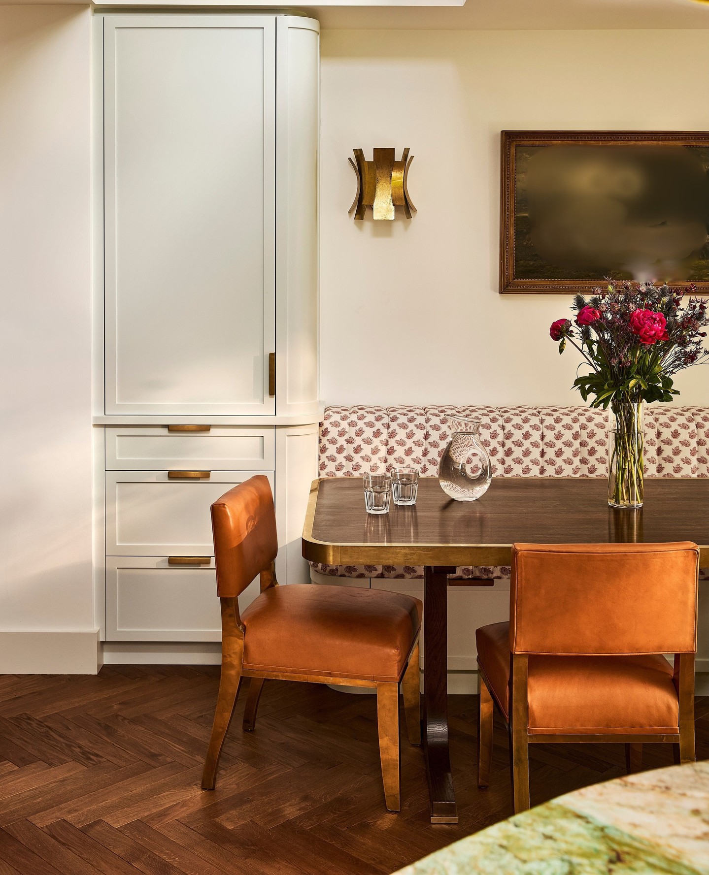 10. Warm a Compact Dining Nook with Cognac Leather