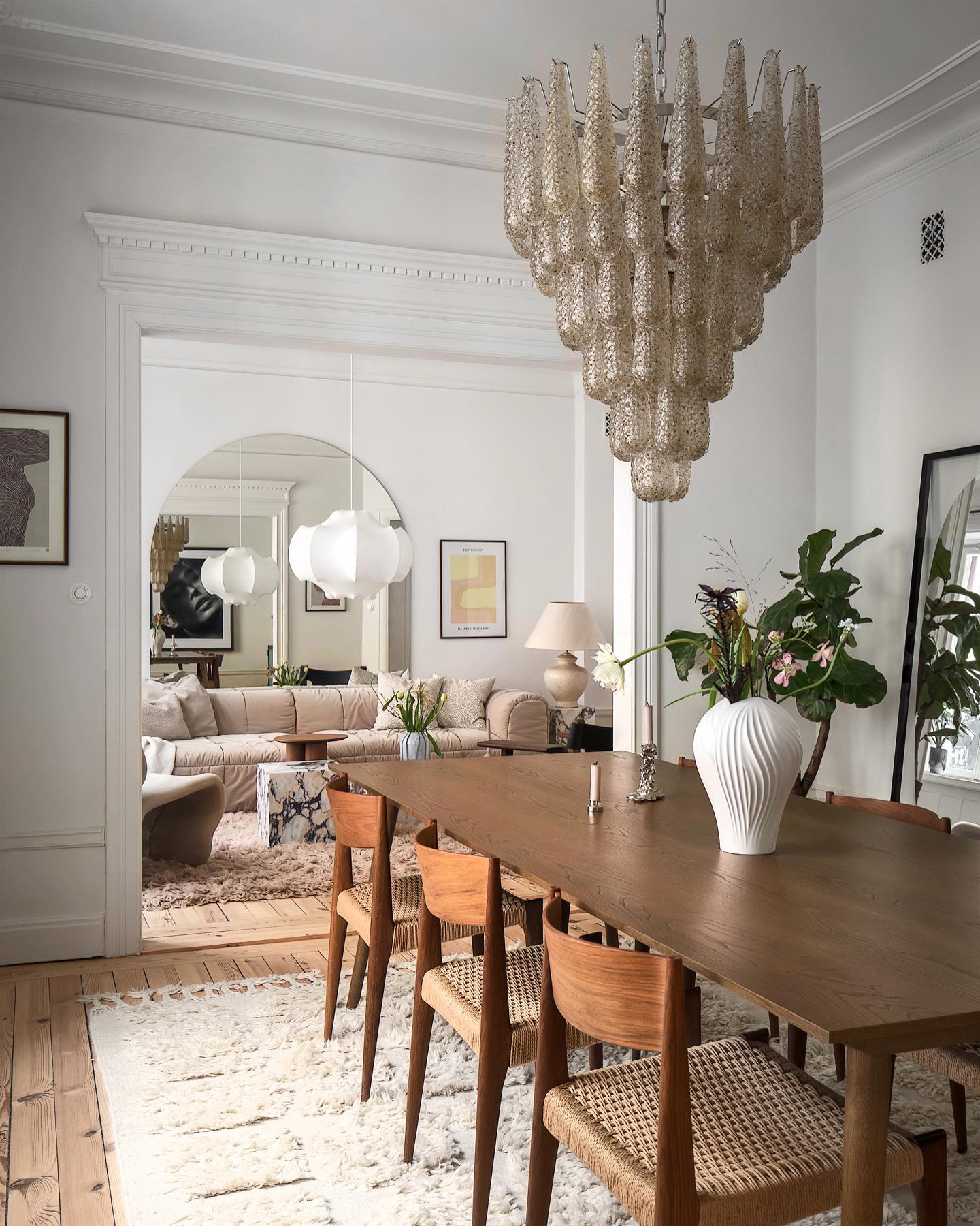 17. Pair Danish Style Chairs with a Dramatic Chandelier
