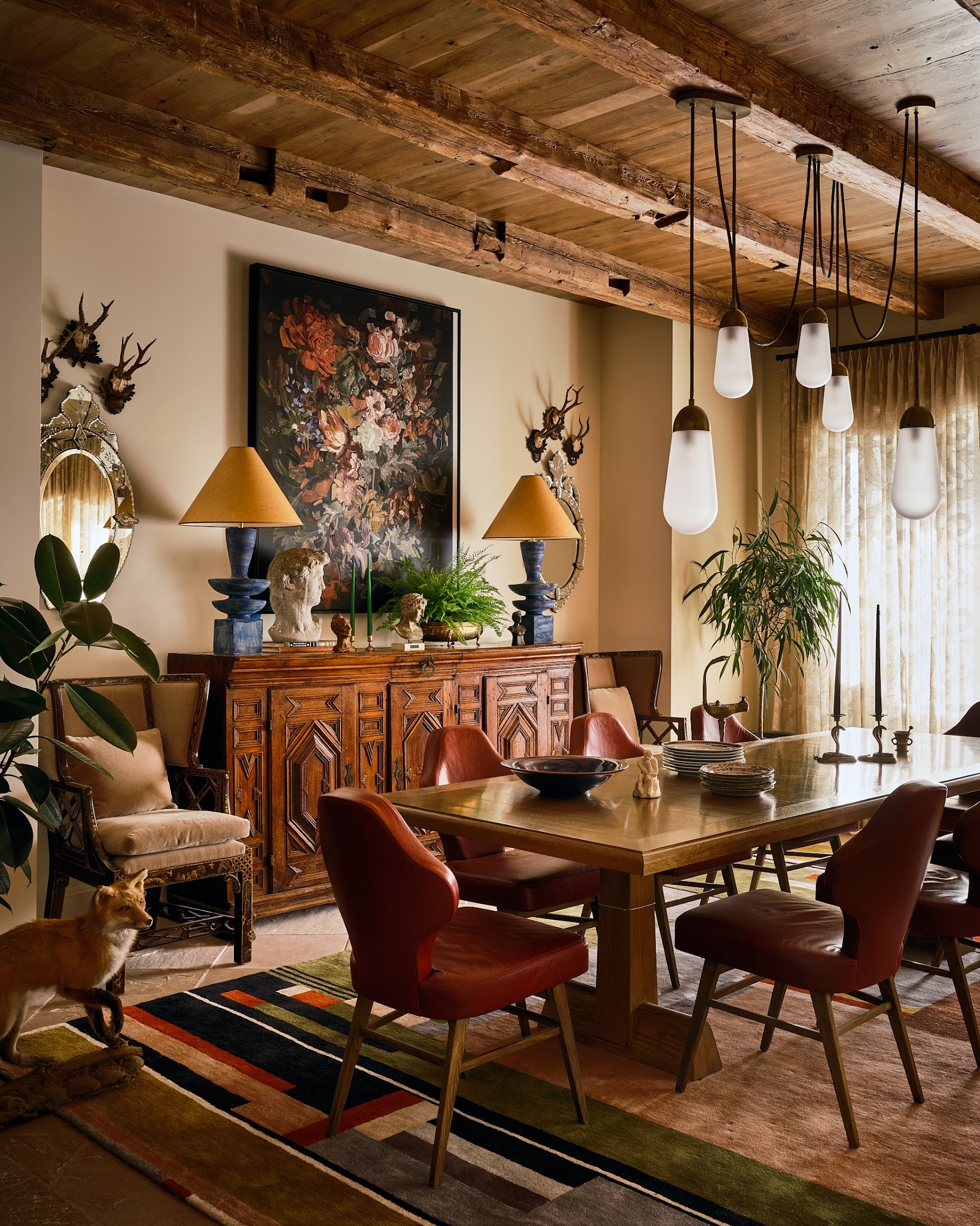 18. Add Sculptural Red Chairs to a Collected Dining Room