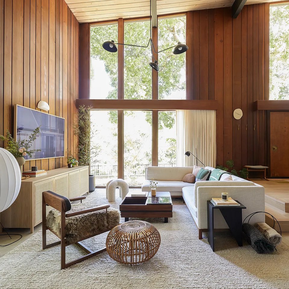 2. Balance Tall Wood Paneling With Pale Seating