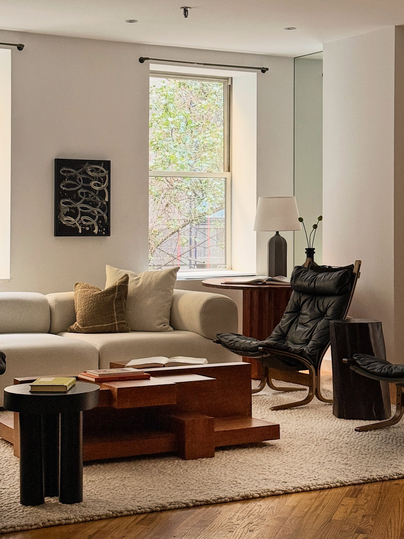5. Contrast Soft Upholstery With a Dark Leather Chair