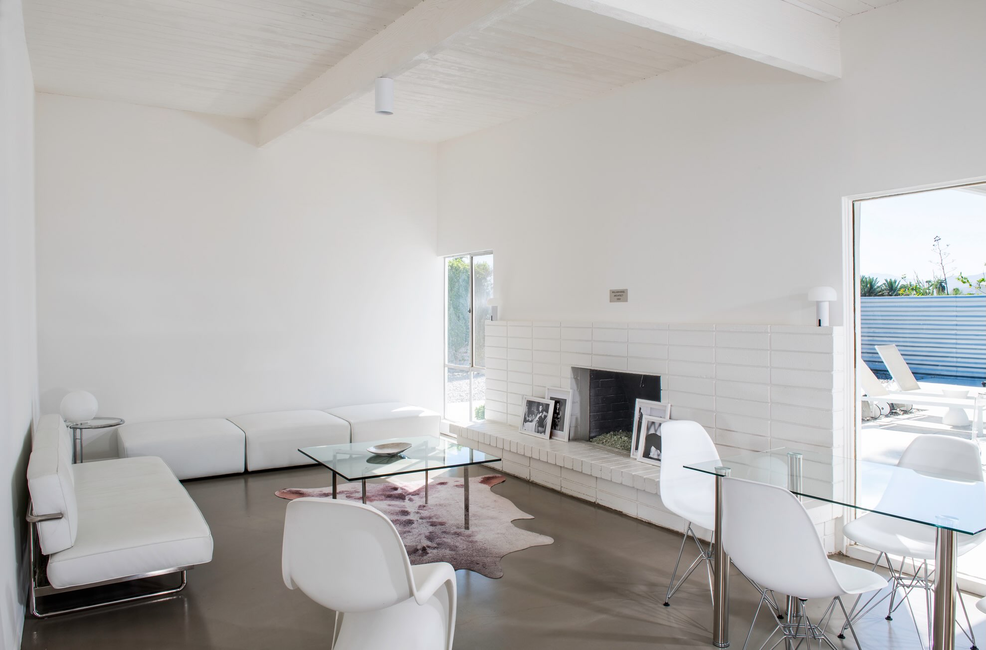 19. Keep a Patterned Rug Visible With a Glass Table