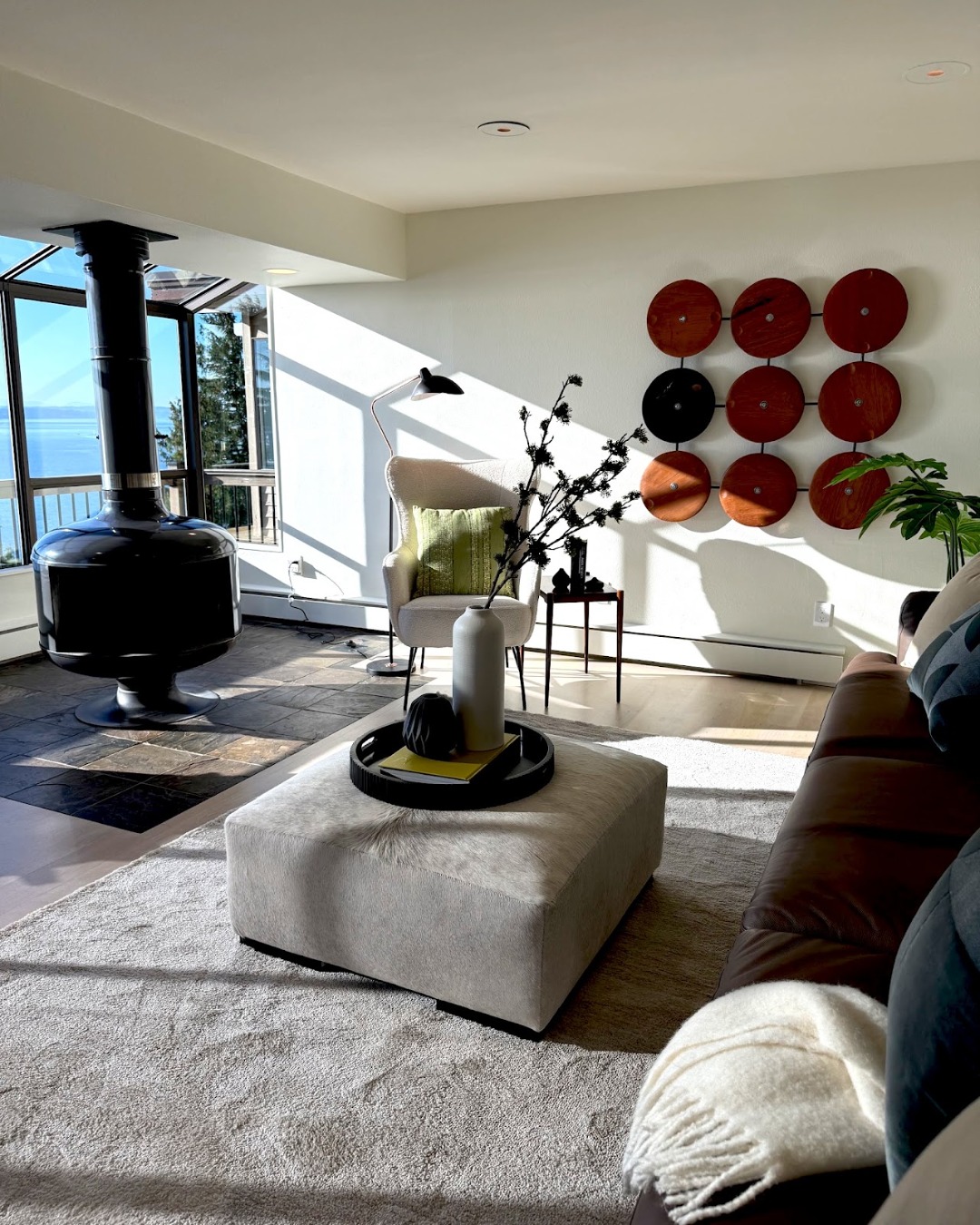 17. Repeat Rounded Forms Around a Black Fireplace