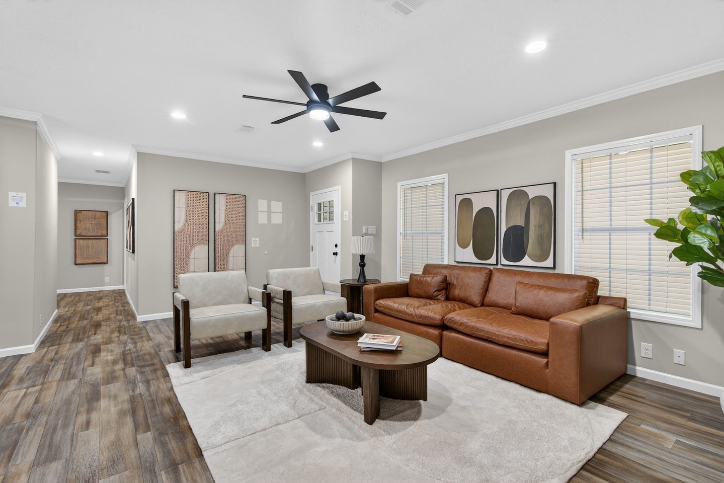 14. Warm Up a Neutral Room With Cognac Seating