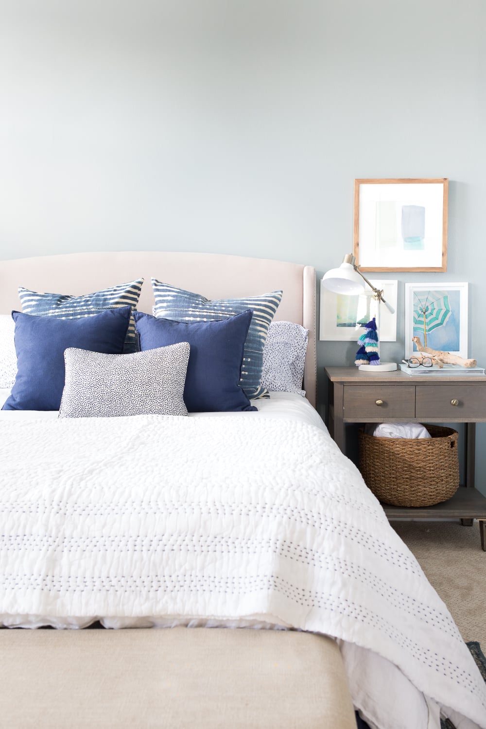 10. Arrange Small Coastal Art Beside the Headboard