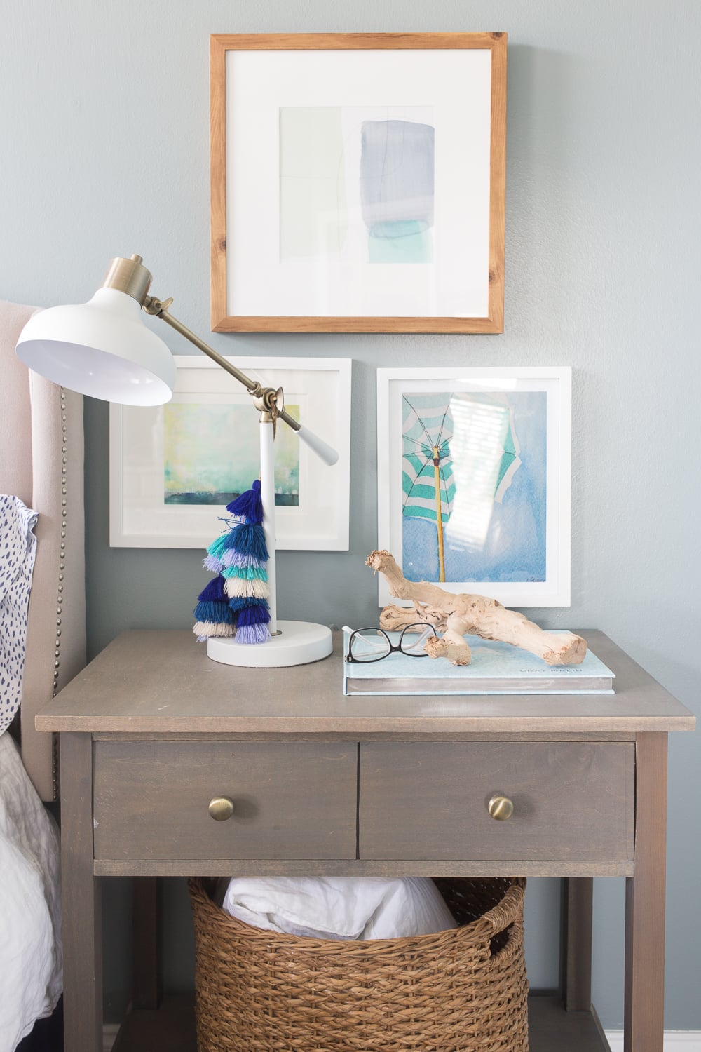 17. Mix a Modern Task Lamp With Beach Art