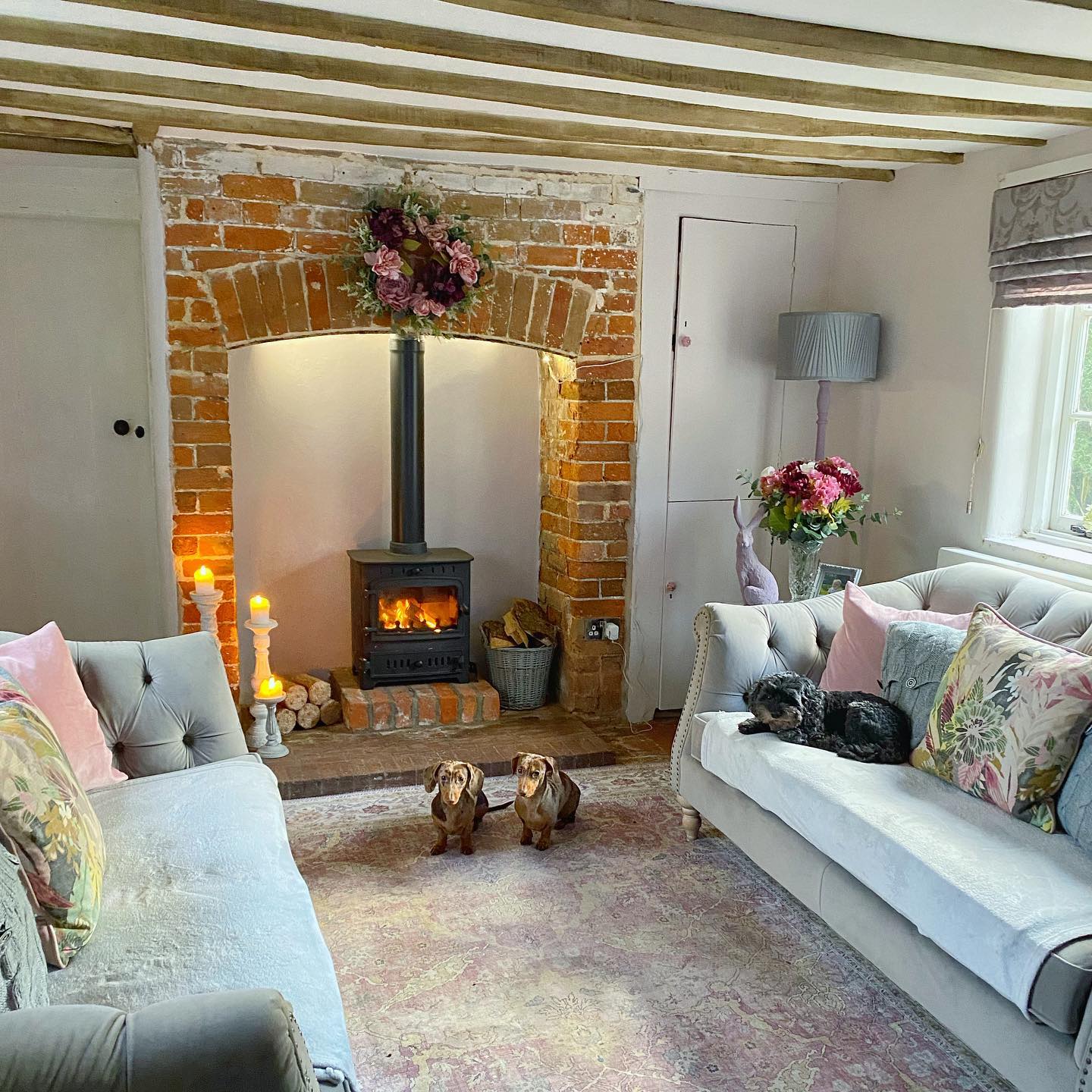 3. Pair a Brick Hearth With Soft Blue Seating